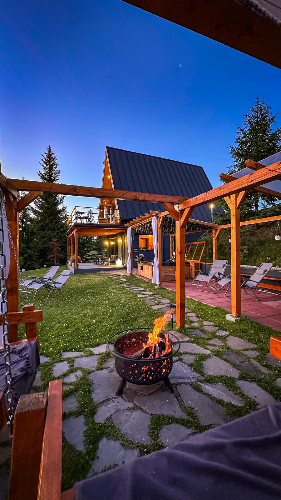 Evening outdoor space with fire pit and seating