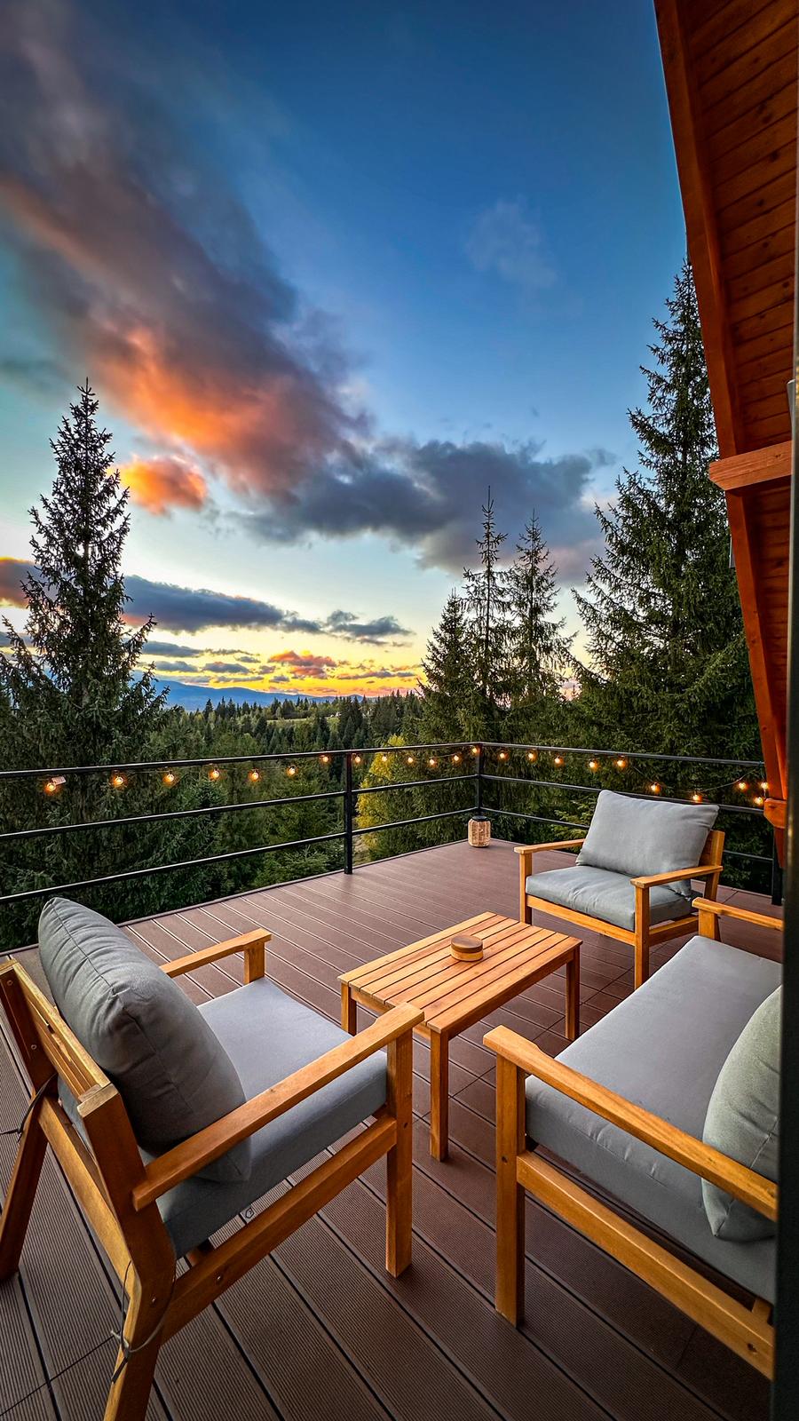 Sunset view from cabin deck with mountain panorama